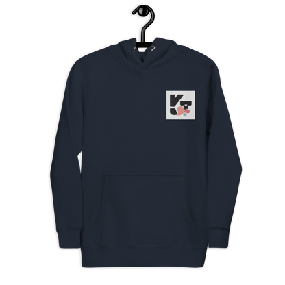 Unisex-Kapuzenpullover "Hütehund" von der Marke Klexgetier. Der dunkelblaue Pullover mit der grafischen Hundeillustration auf dem Ärmel ist ideal für Hundeliebhaber und Agility-Sportler.