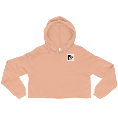 Crop-Hoodie "Tunnel Malinois" von Klexgetier - ein sportliches, orangenfarbenes Oberteil mit Kapuze und dem markanten Logo der Marke.