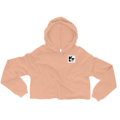 Leichter, rosa Crop-Hoodie mit Kapuze und einem kleinen, stilisierten Logo in der Ecke. Der Hoodie ist ein modisches und sportliches Kleidungsstück, das perfekt für aktive Hundebesitzer und Sportbegeisterte ist.